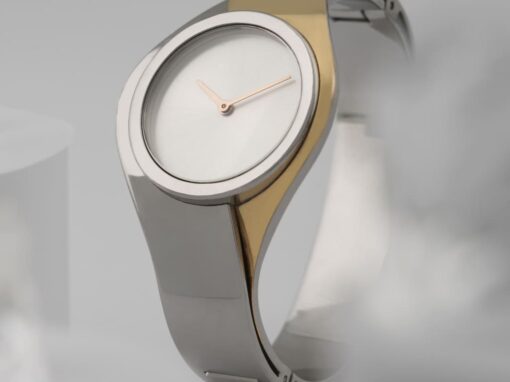 Reloj análogo bicolor gris dorado